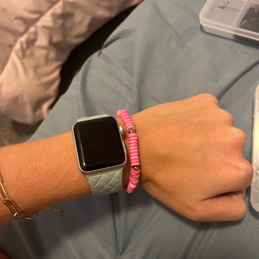 Pink bracelet with gold accents